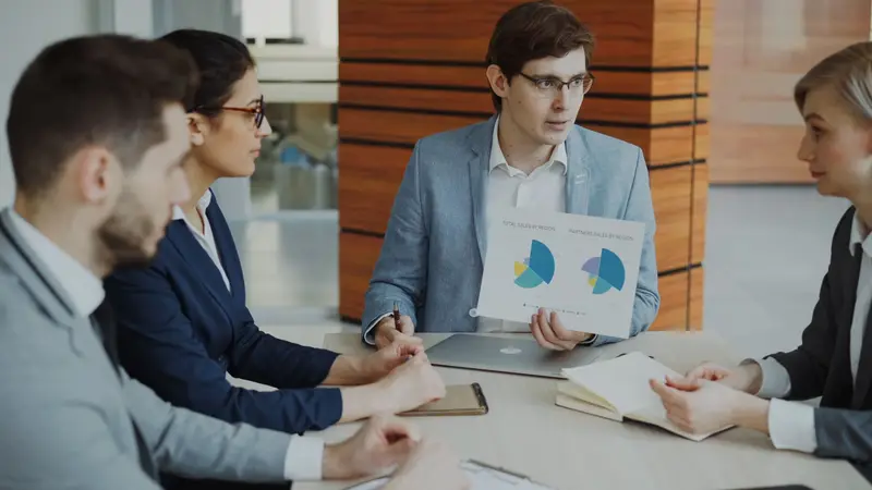 Sales implementation challenge — team members reviewing failed deployment timeline and architectural issues in conference setting — mid-market adoption obstacles