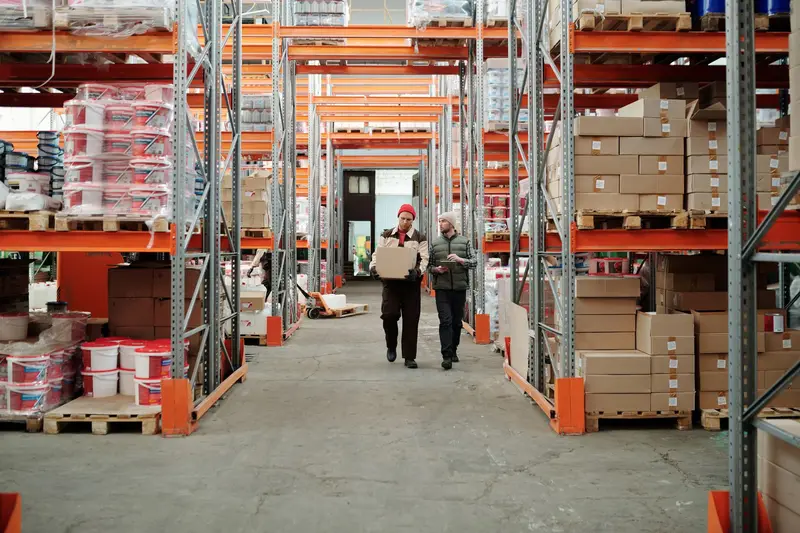AR Use Cases — worker using augmented reality headset to locate inventory in warehouse shelves — surviving mid-market deployment scenarios